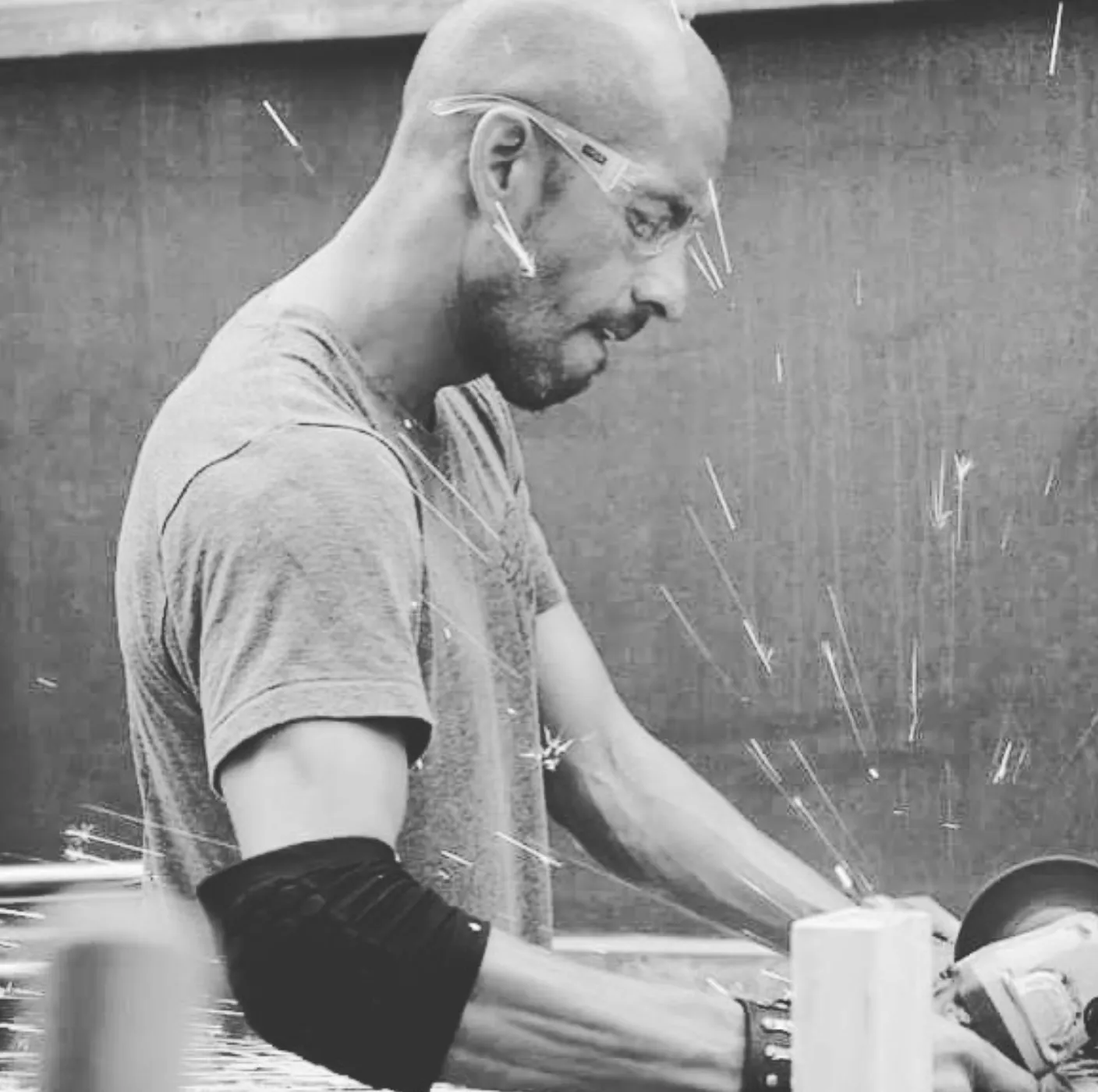 Mario cutting steel in his shop